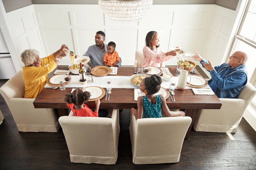Family having breakfast at the dining table | Ron's Carpet & Design